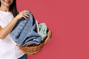 A girl, a housewife, with a basket of laundry.