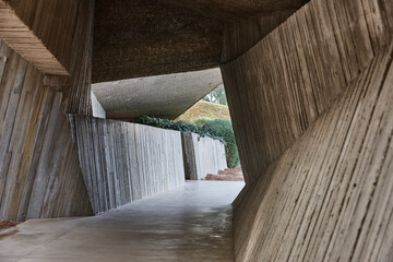 Brutalist architecture in Spain. Empuries ruins geometric concrete passage entrance.