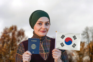 Muslim Woman Holding Passport and Flag of South Korea
