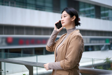 Professional Businesswoman Engaged in a Phone Call - 777005882