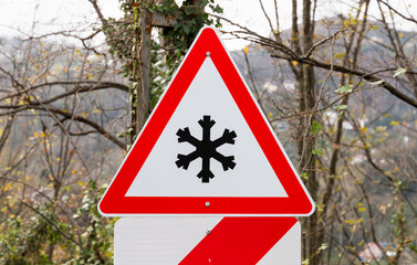 Risk of snow and ice ahead road sign - 777011679