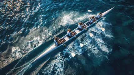 Foto op Canvas Aerial drone capture of synchronized canoe rowing team competing in vast blue sea © Ilja