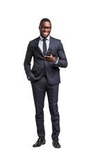 A dark-skinned businessman stands and smiles, holding a mobile phone.