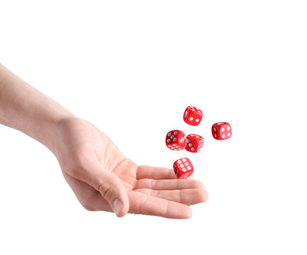 Man throwing red dice on white background, closeup