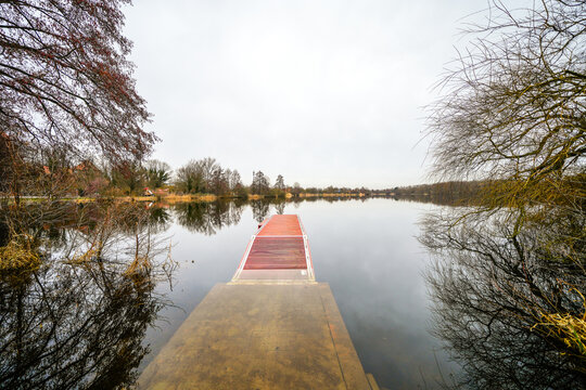 View of Lake Thielenburg and the surrounding landscape near Dannenberg on the Elbe. Nature in winter by the river.
