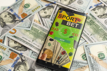 betting on sports, smart phone with working online betting mobile application - obrazy, fototapety, plakaty