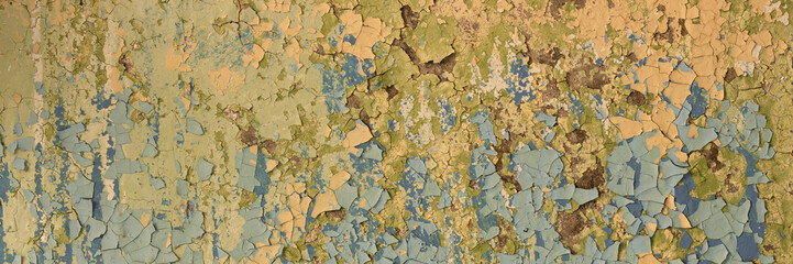 Peeling paint on the wall. Panorama of a concrete wall with old cracked flaking paint. Weathered rough painted surface with patterns of cracks and peeling. Wide panoramic texture for grunge background - 777057669