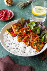 Fried tofu with rice and salad. Vegetarian food. Healthy eating. Diet.