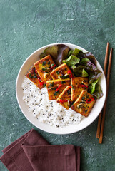 Fried tofu with rice and salad. Vegetarian food. Healthy eating. Diet.