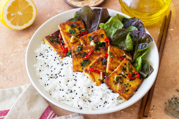 Fried tofu with rice and salad. Vegetarian food. Healthy eating. Diet.