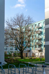 Berlin, Germany, March 7, 2024: housing blocks in Adlershof neighbourhood built around a green...