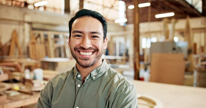 Business, man and happy portrait in woodwork, skilled and confident Asian male person in carpentry trade company. Craftsmanship, wood product and manufacturer with smile and arms crossed in workshop