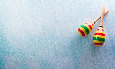 Cinco de Mayo holiday background made from maracas on pastel blue background.
