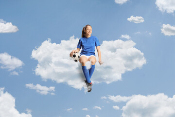 Teenage girl in a football jersey sitting on a cloud