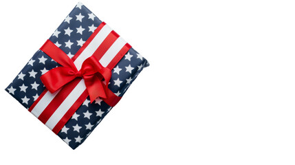 Obraz premium An American flag-themed gift box tied with a bold red ribbon, perfect for patriotic events or holidays like the Fourth of July, Independence day, Memorial Day. White background