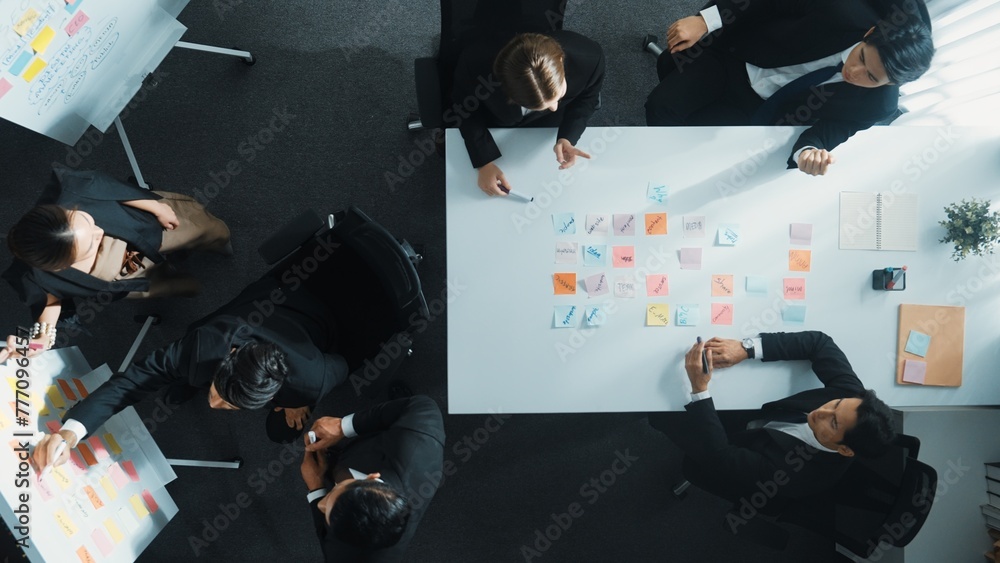 Aufkleber top down aerial view of business group sharing and brainstorming idea by using sticky notes at meeti