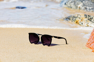 sunglasses by the sea, vacation and rest time.
