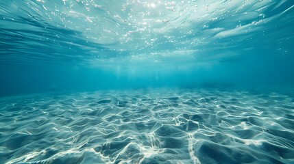 Fototapeta premium Photo of clear blue water, with light ripples and small waves on the surface, in shallow waters, with a view from above, looking down at the bottomless ocean.