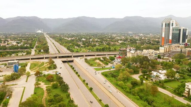 Islamabad Beautiful Expressway, Faisal Avenue, Roads And Margalla Hills with Faisal Mosque. Aerial view. Islamabad , Pakistan - 02 26 2024
