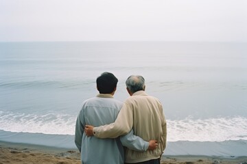 Fototapeta premium Senior father hugging son, have a happy feeling together. Happy active senior couple having fun outdoors. Generative AI.