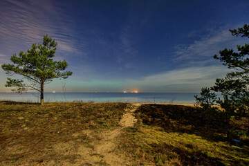 A beautiful beach of the Sobieszewo Island at the Baltic Sea at night. Poland