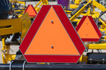 Red Reflective Triangle Sign at Agriculture Trailer