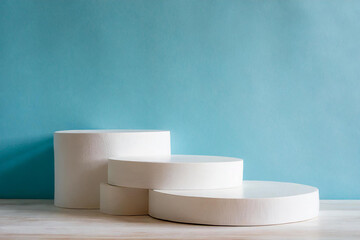 Blue round podium on blue background. Minimalist scene. Perfect backdrop for showcasing products.