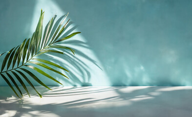 Shadow of a palm leaf cast upon a white wall background, evoking a natural summer vibe. Perfect...