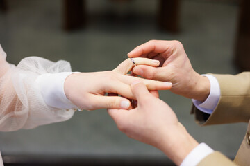 Wedding ring image which show putting a ring on a bride 's finger by a groom. It is a happy moment...