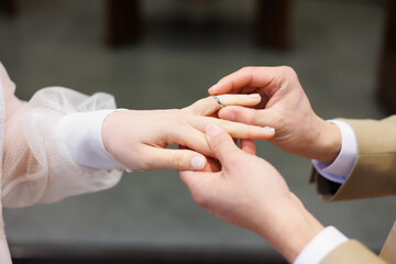 Wedding ring image which show putting a ring on a bride 's finger by a groom. It is a happy moment...