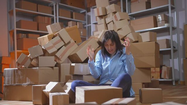 a warehouse worker, a woman in a panic, a mountain of boxes, a mistake in logistics, screams stress
