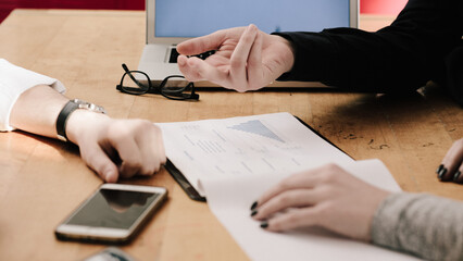 Anonymous young business team working at office desk