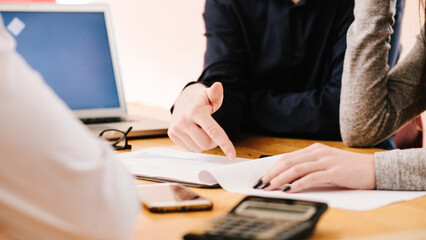 Anonymous young business team working at office desk