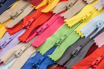Multicolored Plastic Zippers or Zip Fasteners with sliders pattern for handmade sewing tailoring...