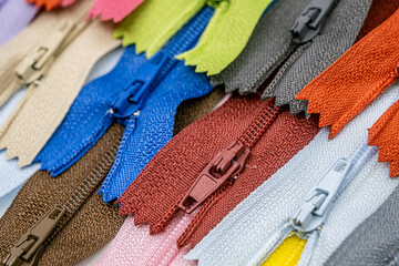 Multicolored Plastic Zippers or Zip Fasteners with sliders pattern for handmade sewing tailoring...