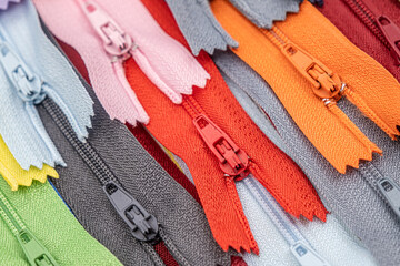 Multicolored Plastic Zippers or Zip Fasteners with sliders pattern for handmade sewing tailoring...