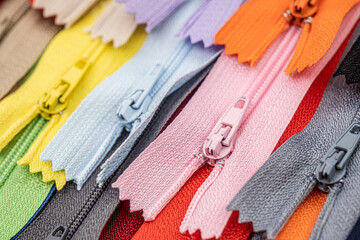 Multicolored Plastic Zippers or Zip Fasteners with sliders pattern for handmade sewing tailoring...