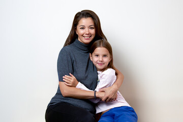 Happy mother having fun with her daughter, close-up portrait