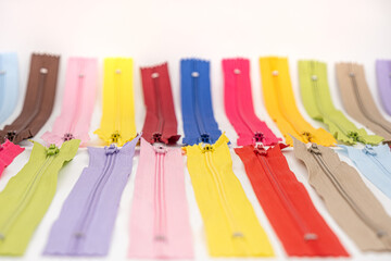 Multicolored Plastic Zippers or Zip Fasteners with sliders pattern for handmade sewing tailoring...