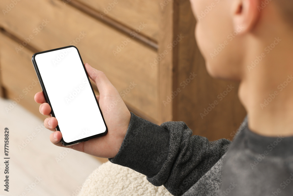 Poster man using smartphone with blank screen indoors, closeup. mockup for design
