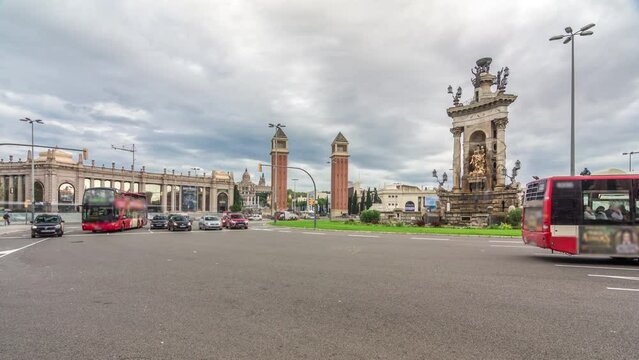 Timelapse Hyperlapse of Placa d'Espanya, Spain Square with Venetian Towers and the National Art Museum. Dynamic Traffic Circulates Around the Roundabout, Capturing Heartbeat of Barcelona's Cityscape
