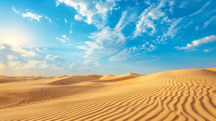 Majestic desert landscape with towering sand dunes and a clear blue sky.