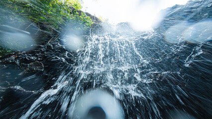 Dynamic View of Water Splashing Down a Rocky Waterfall