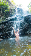 Joyful Moment at the Waterfall