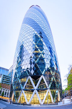 London, UK - May 20, 2023: The Gherkin, formally 30 St Mary Axe and previously known as the Swiss Re Building, a commercial glass skyscraper in London's primary financial district, the City of London