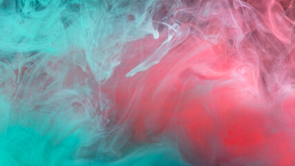 clouds of red and blue turquoise smoke on black background, clouds of paint in water, aquarium,...