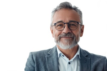 Confident mature businessman smiling for camera on white background.