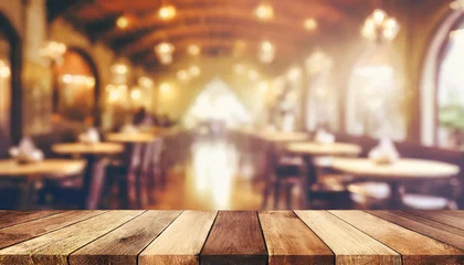 Foto op Plexiglas empty wood table top on blur light gold bokeh of cafe restaurant in dark background © netsay