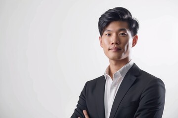 Young Asian businessman isolated on white background. - obrazy, fototapety, plakaty