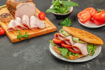 Sandwich with ham, lettuce and tomatoes, Delicious breakfast or snack, top view. copy space